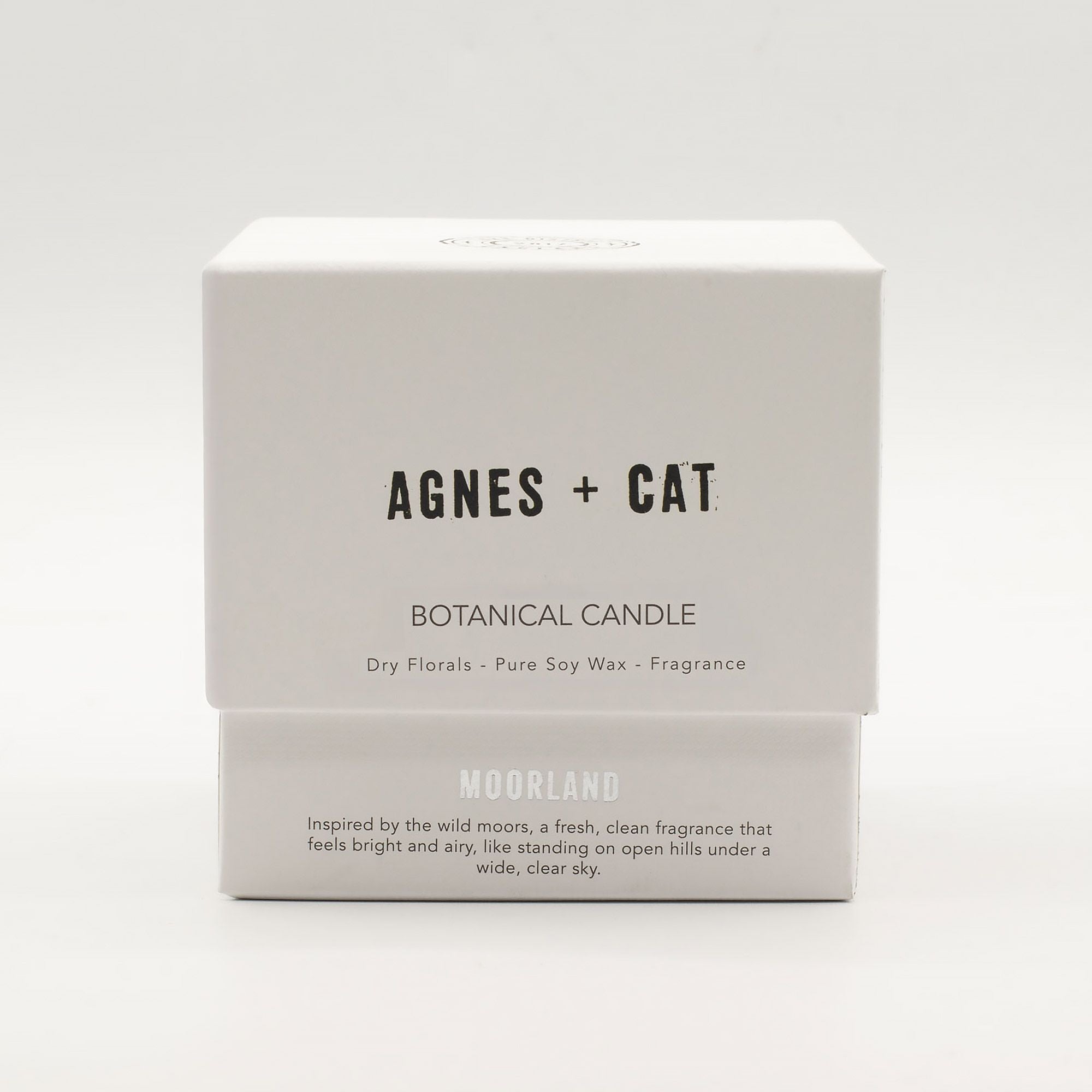 Boxed botanical candle by Agnes + Cat on a white background