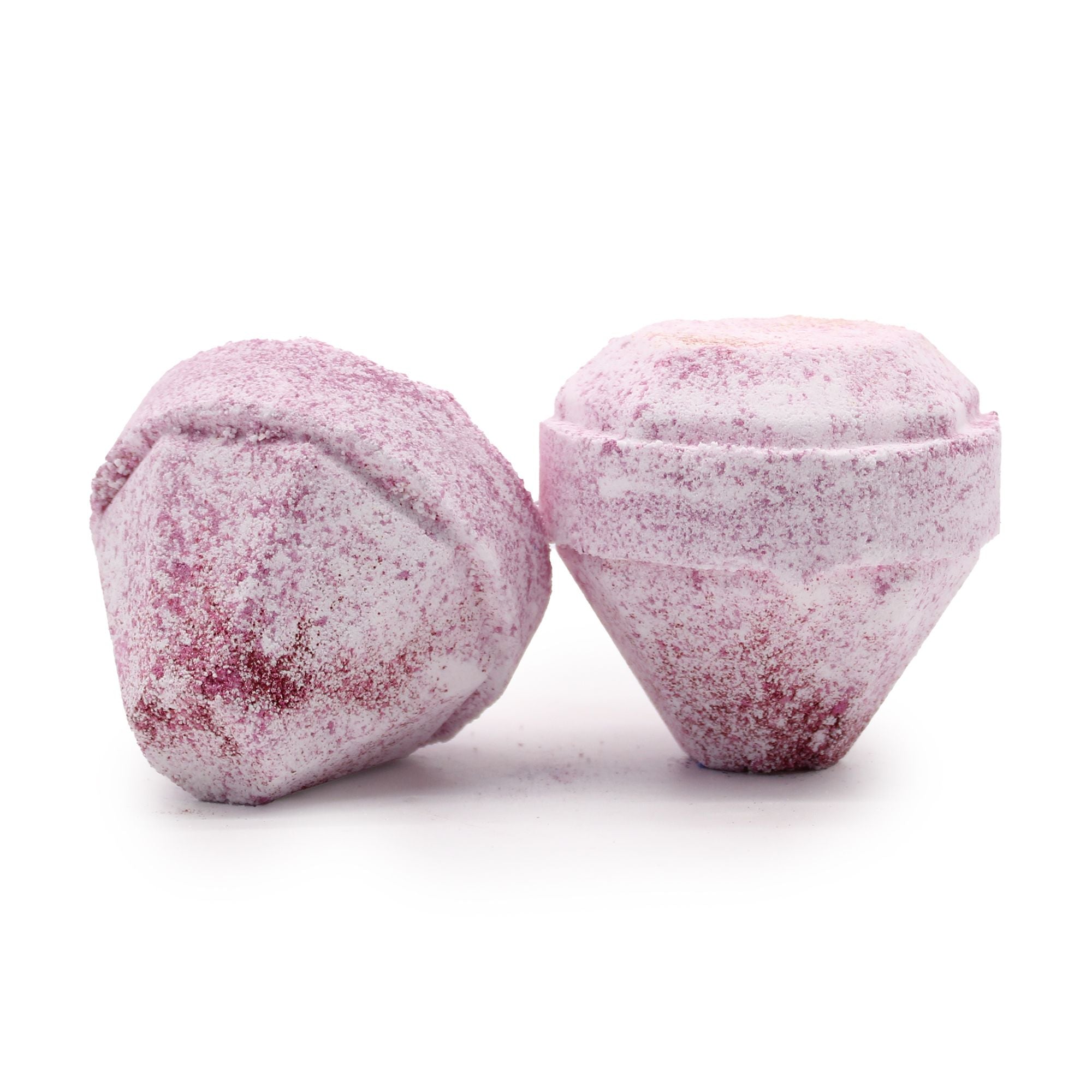 Two pink bath bombs with a textured surface on a white background