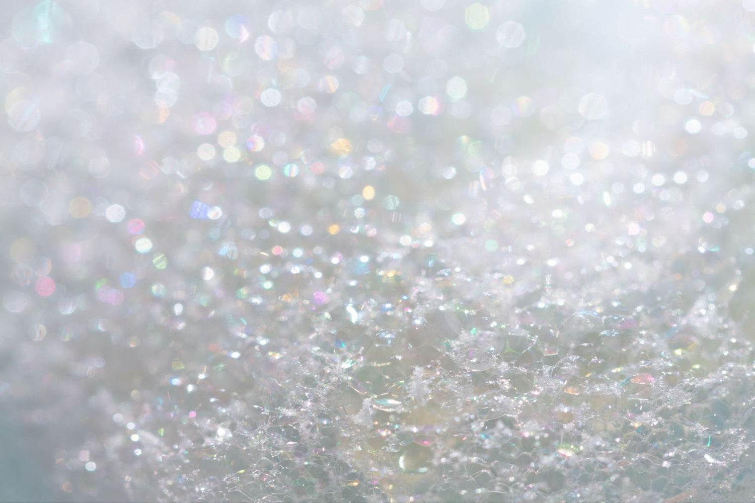 Close-up of glittery texture on a light grey background