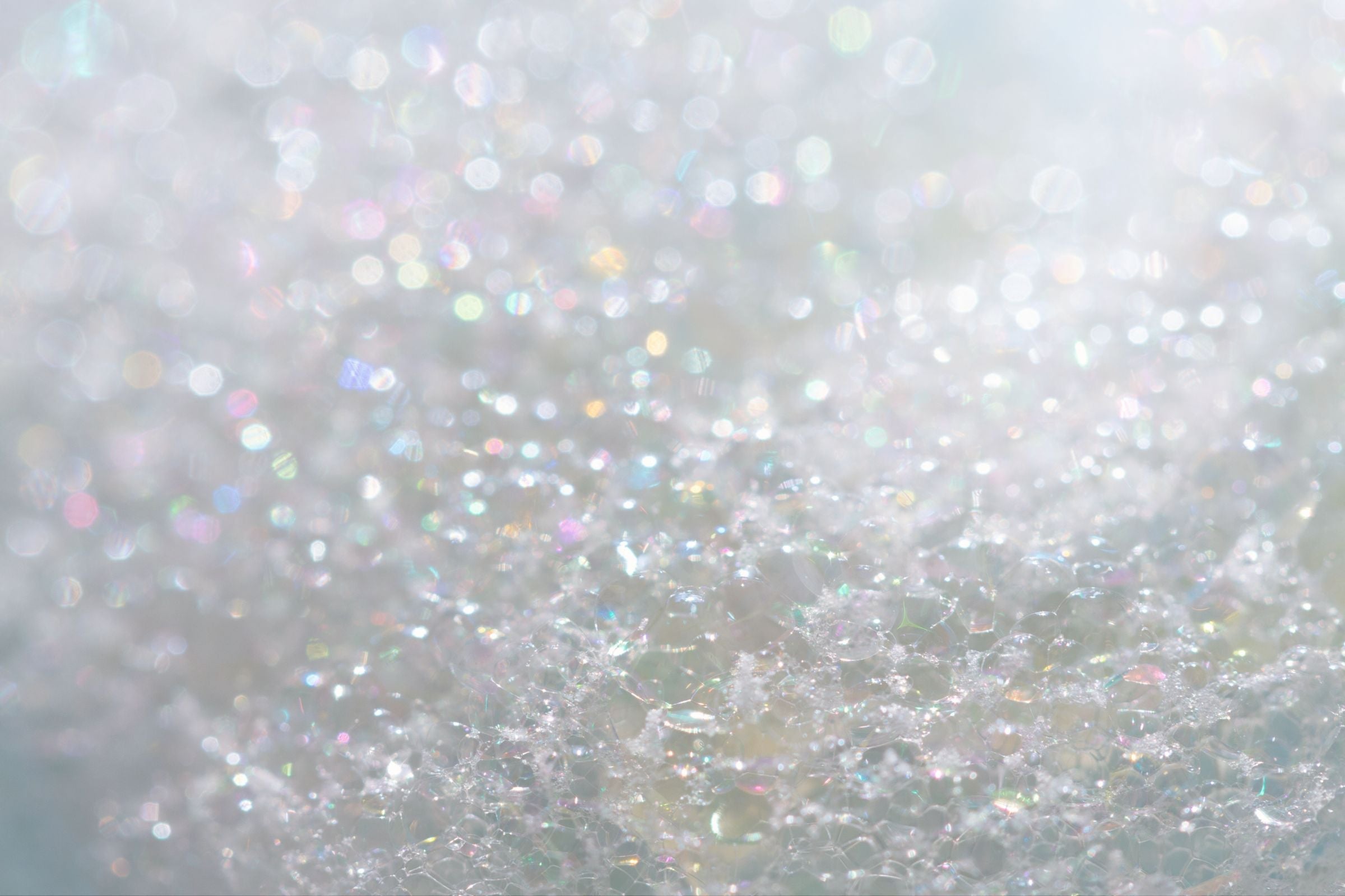 Close-up of glittery texture on a light grey background