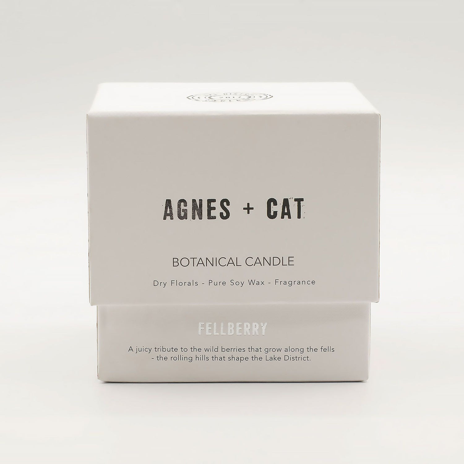Box of Agnes + Cat botanical candle on a white background