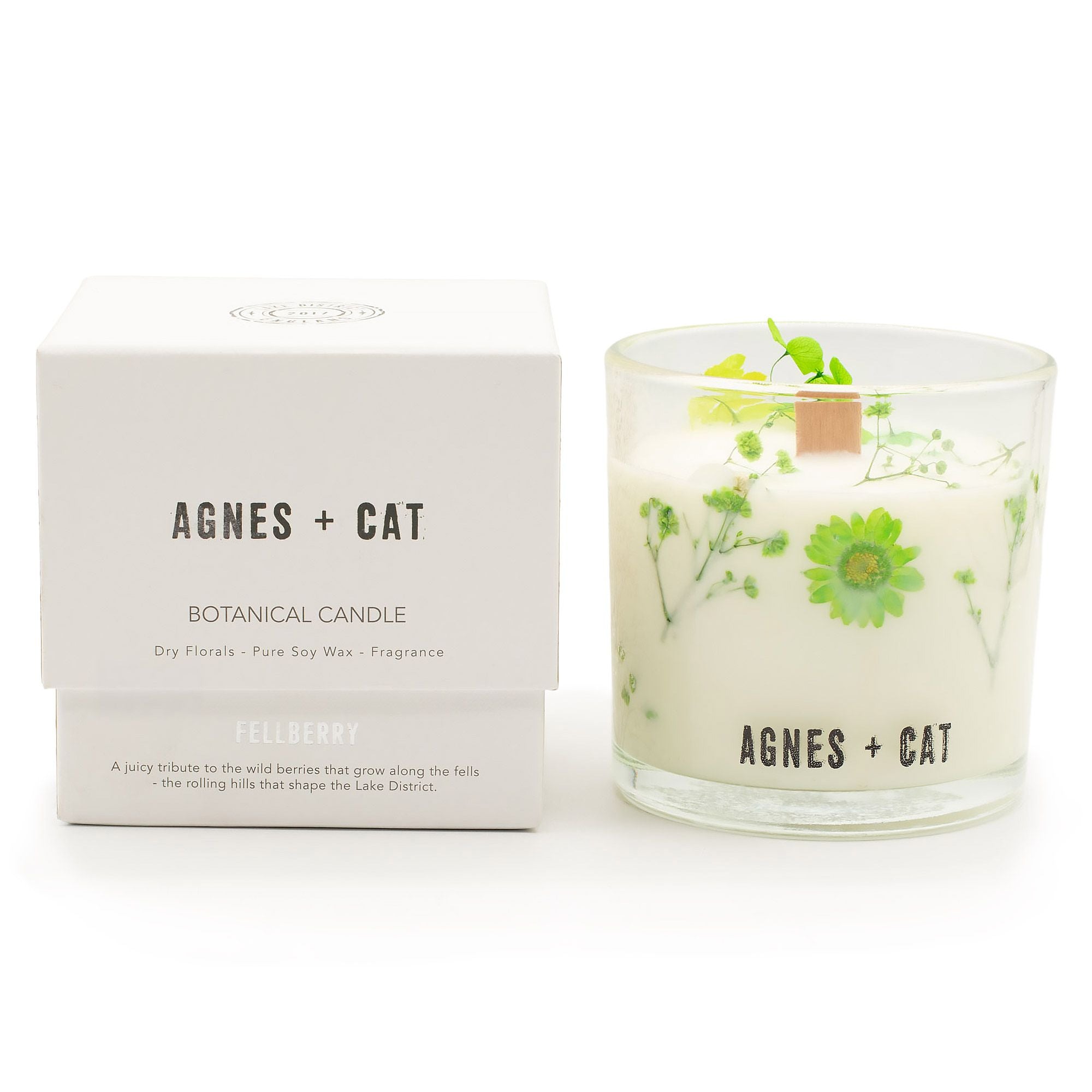Botanical candle with floral design and matching box labeled &