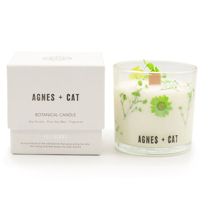 Botanical candle with floral design and matching box labeled &