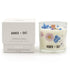 A botanical candle with floral design and matching box labeled &