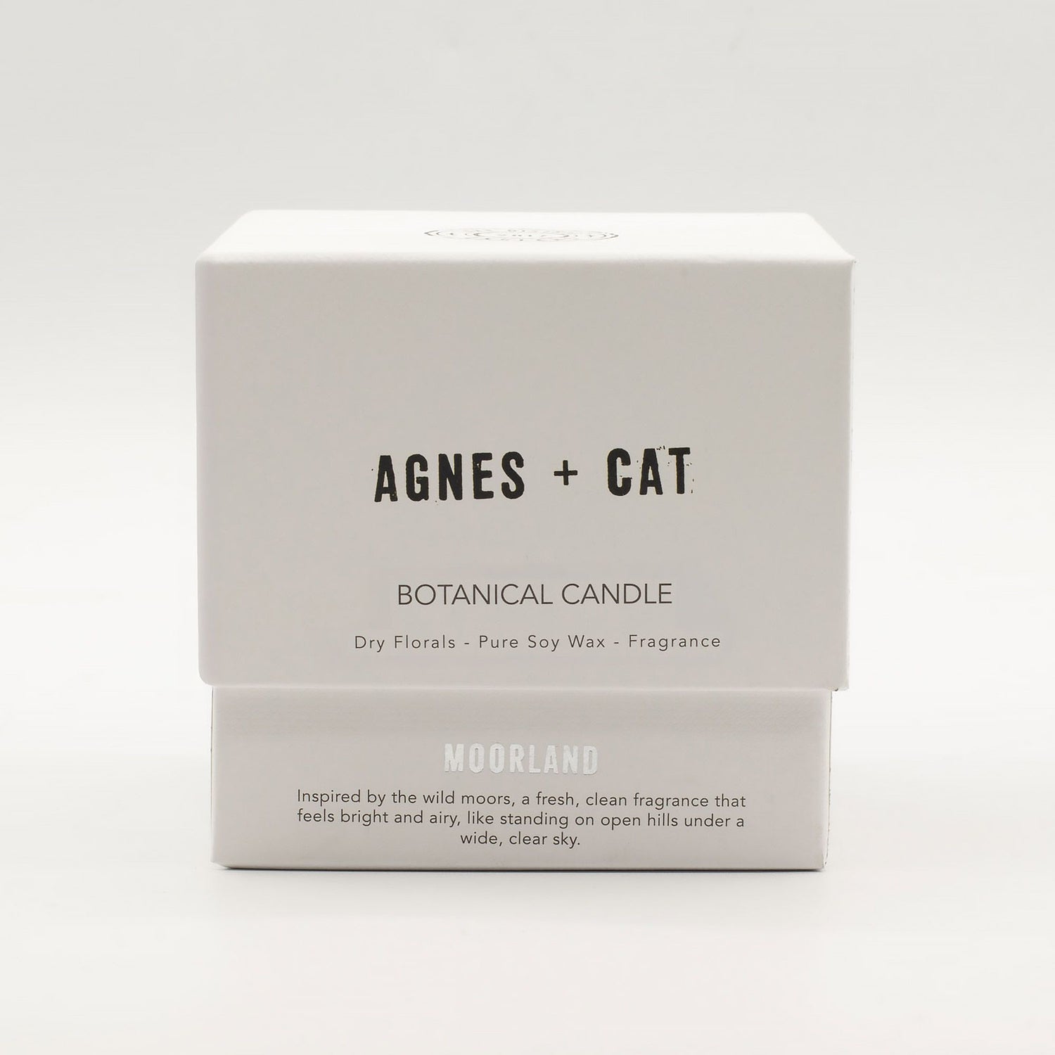 Boxed botanical candle by Agnes + Cat on a white background