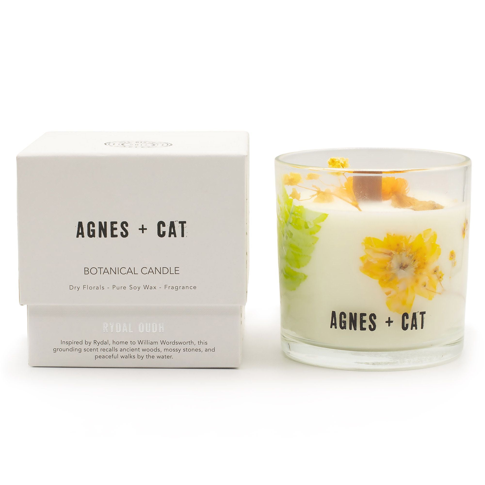 Agnes + Cat botanical candle with packaging on a white background