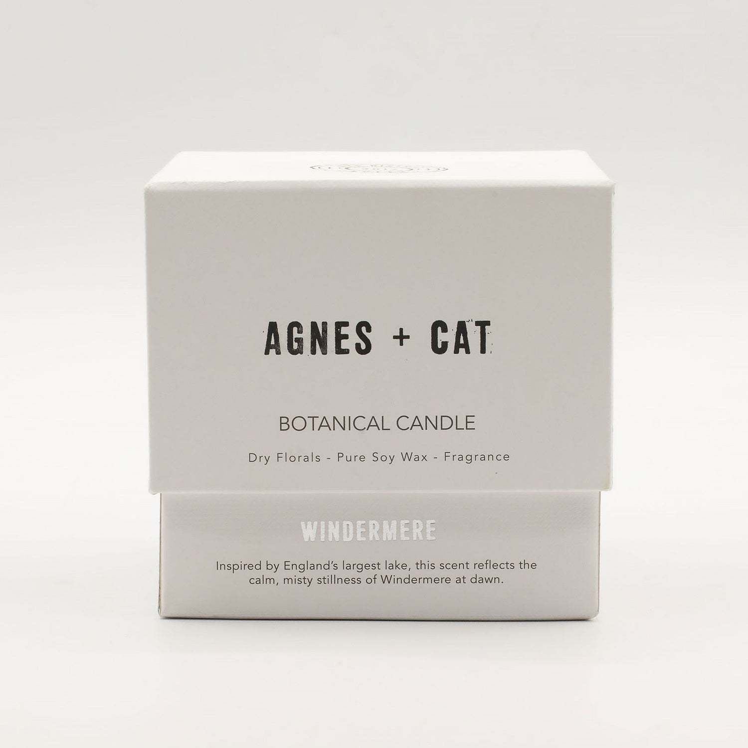 Box of Agnes + Cat botanical candle on a white background