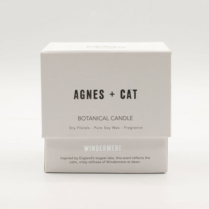 Box of Agnes + Cat botanical candle on a white background