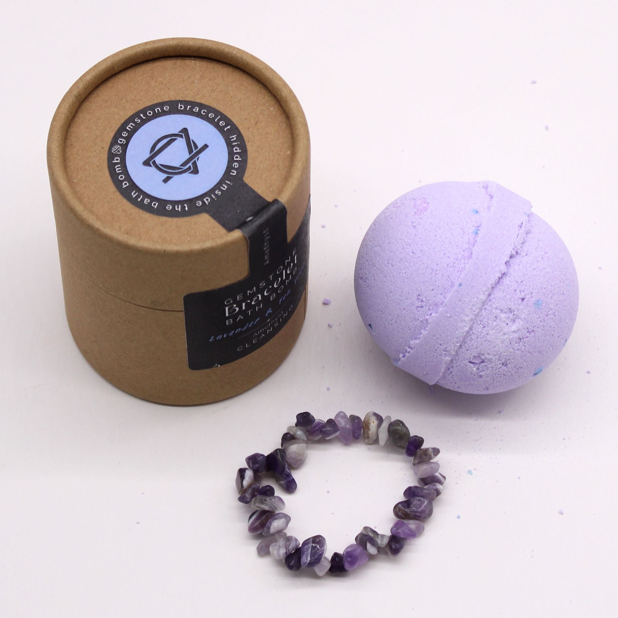 Bath bomb and bracelet with packaging on a white background
