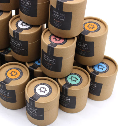 Stack of brown paper boxes with colorful labels on a white background