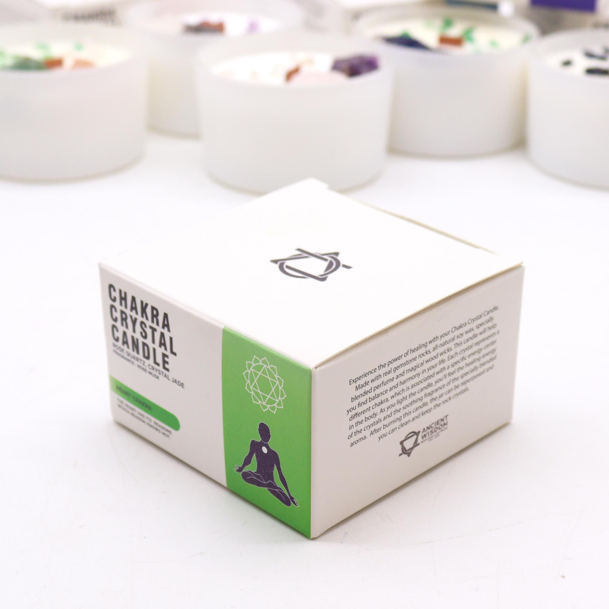 Box of Chakra Crystal Candle with candles in the background