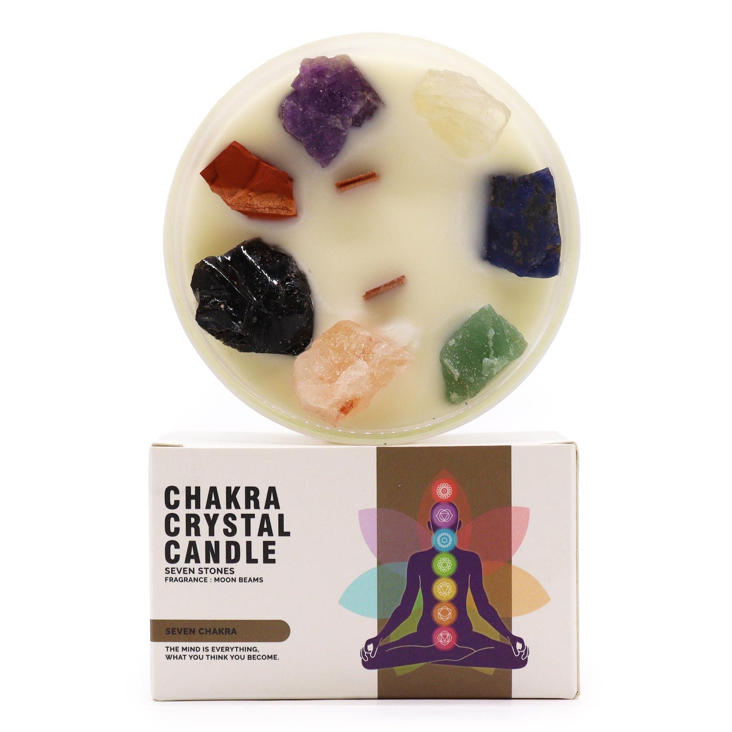 Chakra crystal candle with colorful stones on a white background