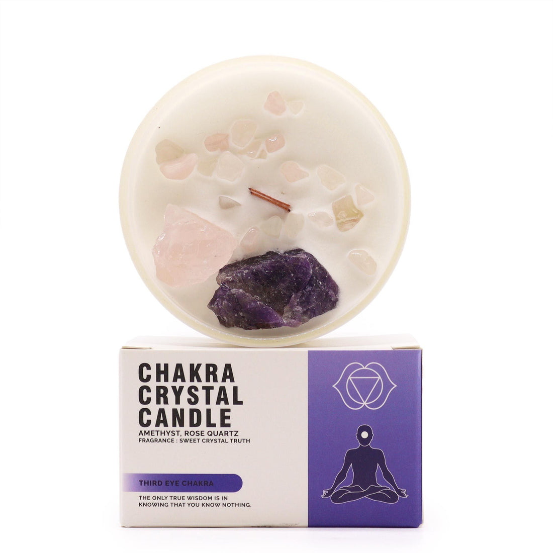 Chakra crystal candle with visible stones on a white background