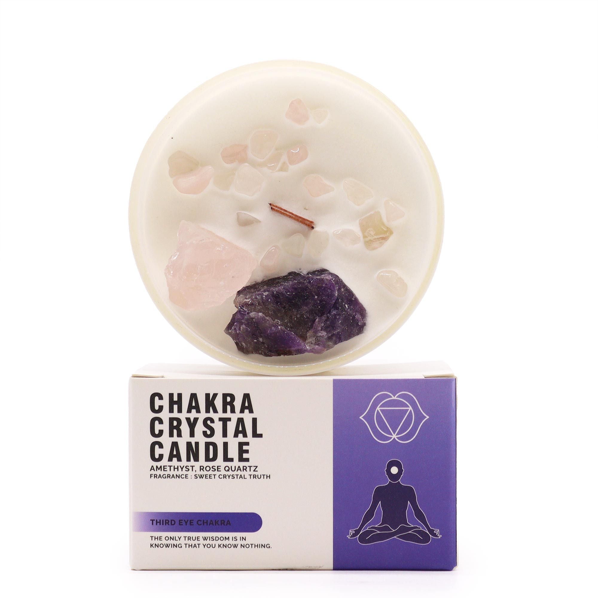 Chakra crystal candle with visible stones on a white background