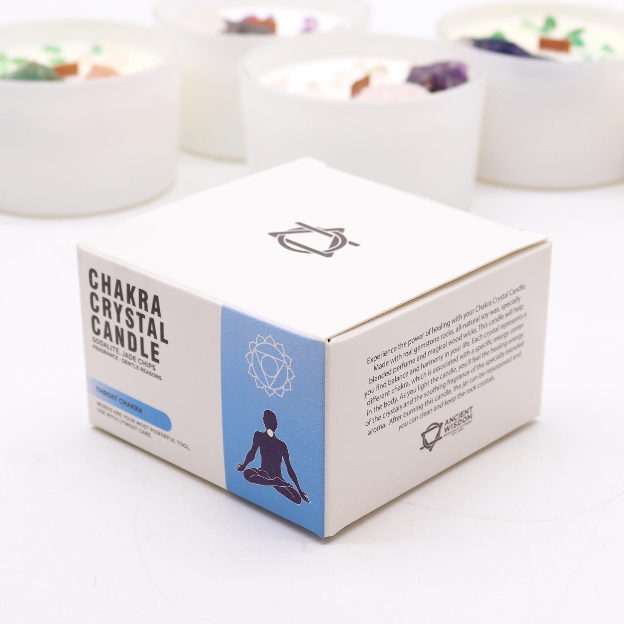 Box of Chakra Crystal Candle with chakra design on a white background