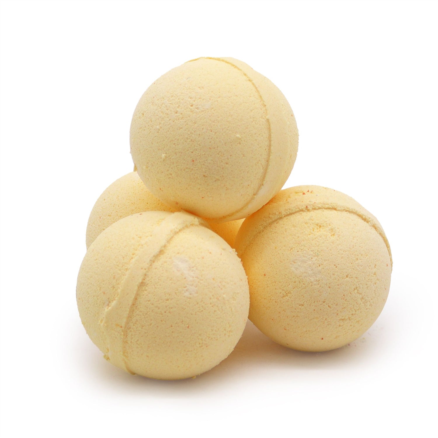 Three yellow bath bombs stacked on a white background