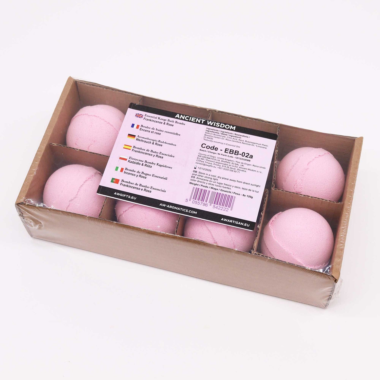Box of pink bath bombs with a label on a white background