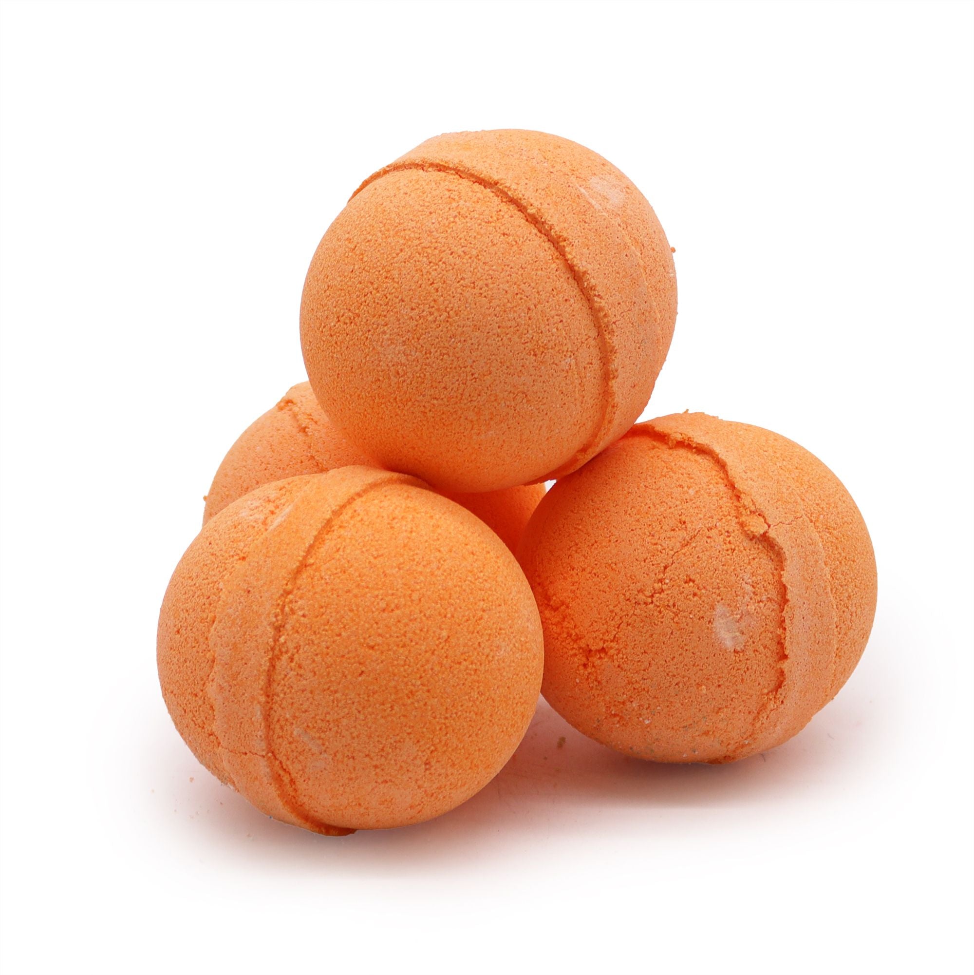 Four orange bath bombs stacked on a white background
