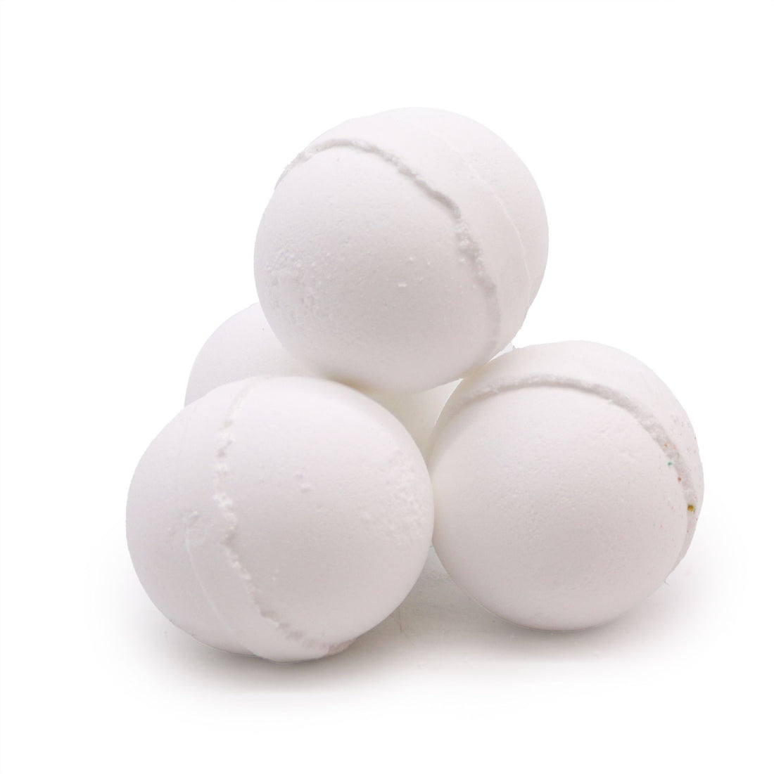 Four white bath bombs stacked on a white background