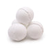 Four white bath bombs stacked on a white background
