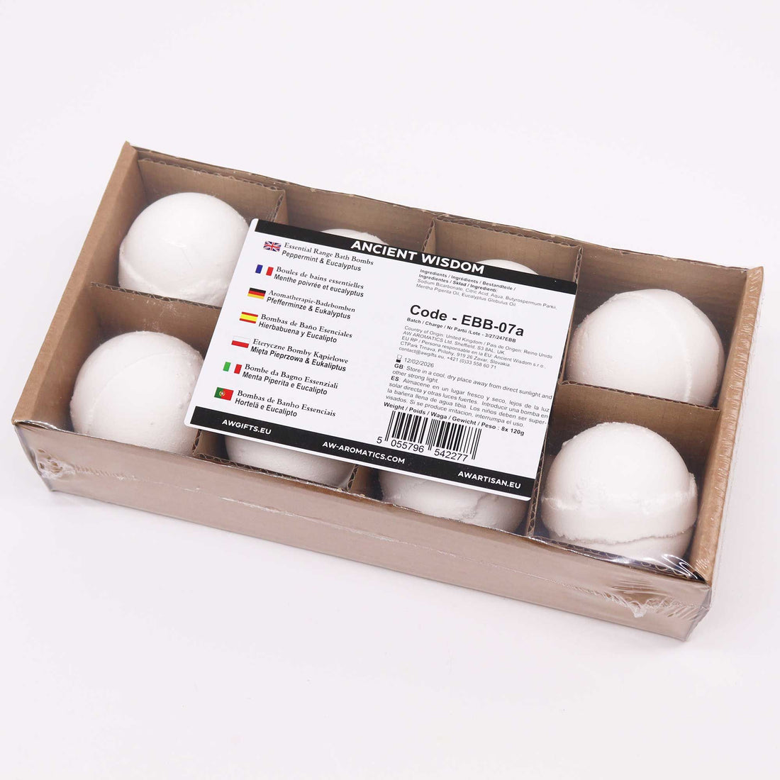 Box of white bath bombs with a label on a white background