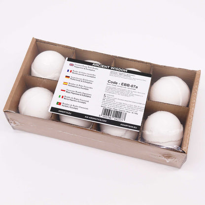 Box of white bath bombs with a label on a white background