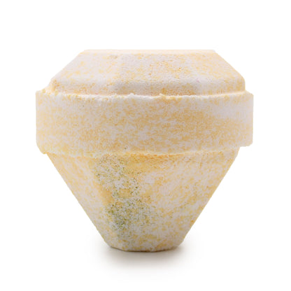 Gemstone-shaped bath bomb with a textured surface on a white background