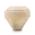 Gemstone-shaped bath bomb with a textured surface on a white background