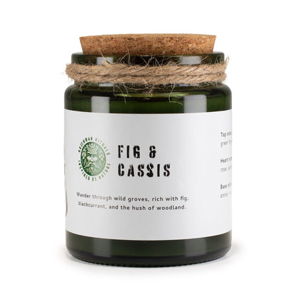 Candle jar with cork lid and white label on a white background