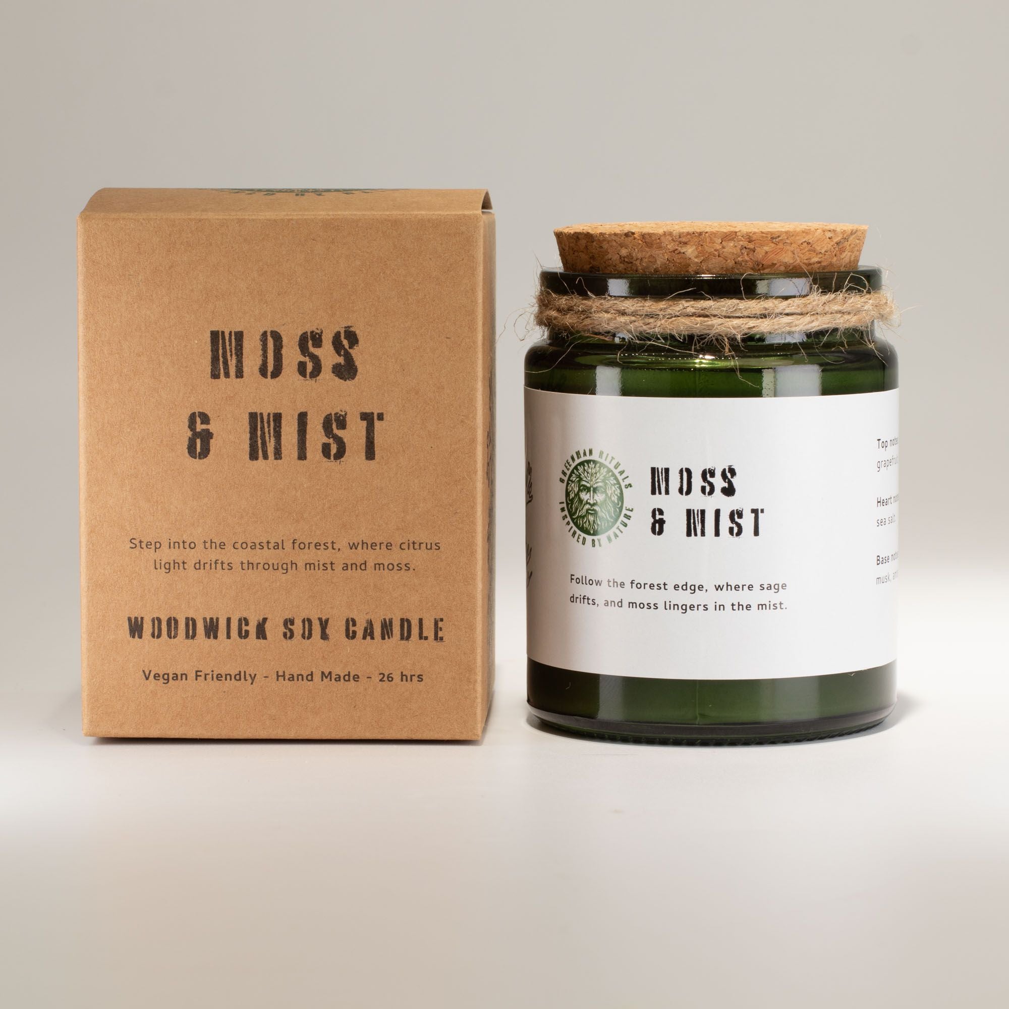 Wooden wick Moss &amp; Mist candle with packaging on a light gray background