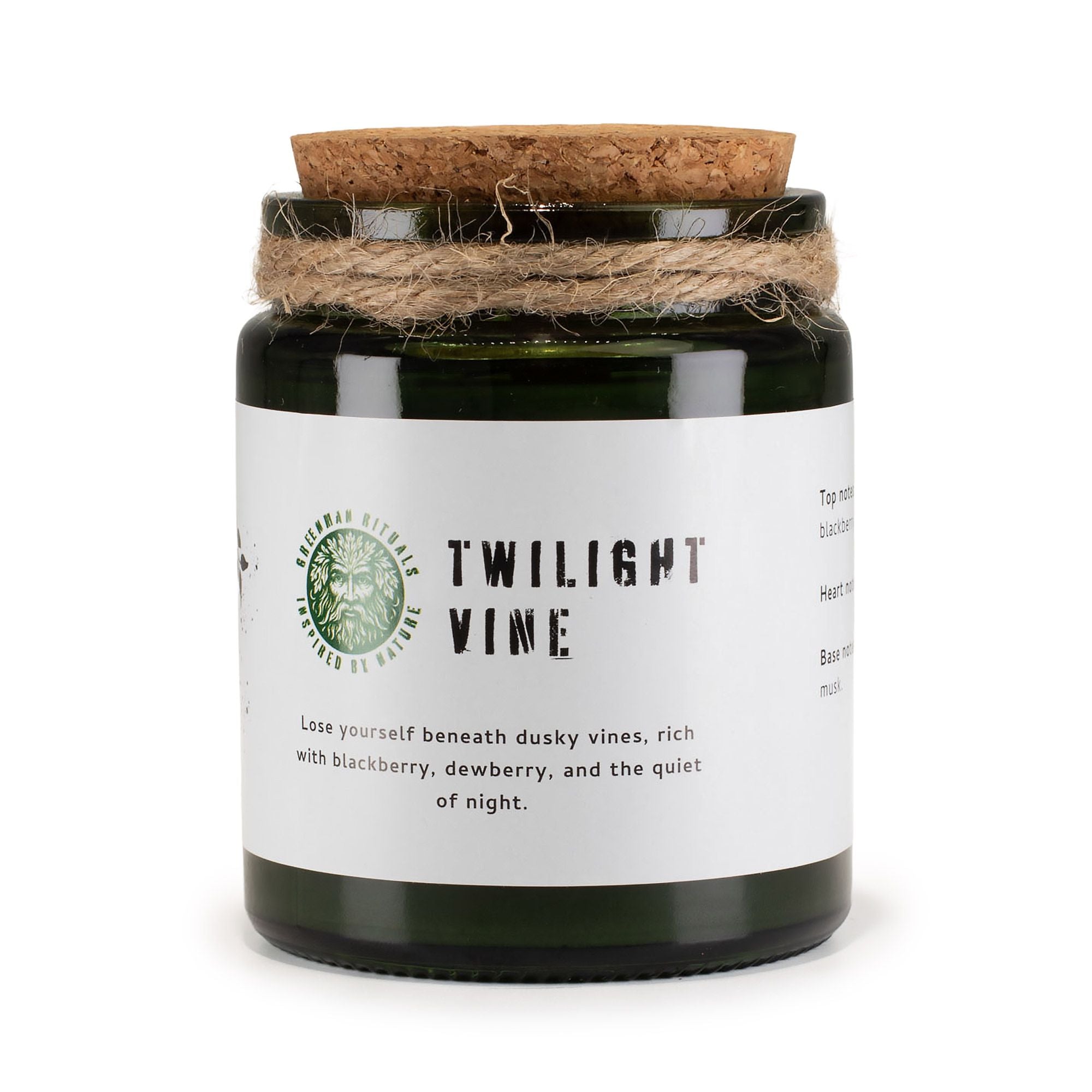 Candle jar with cork lid and white label on a white background