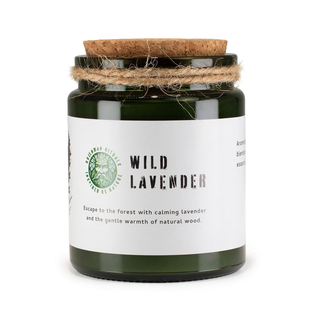 Candle in a green jar with a cork lid on a white background