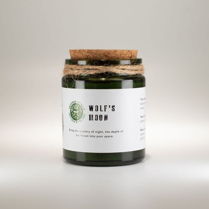Candle with a cork lid and label on a light gray background