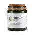 A candle jar labeled &