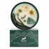 Crystal floral candle with natural elements on a white background