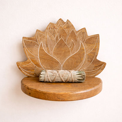 Wooden lotus-shaped shelf with a bundle of incense on a beige background