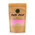 Bath Dust packaging with pink bath salt visible through a window on a white background