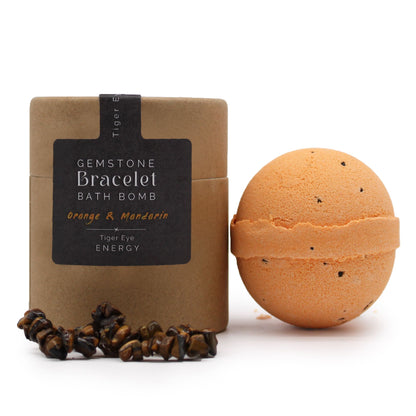Bath bomb with packaging and gemstone bracelet on a white background