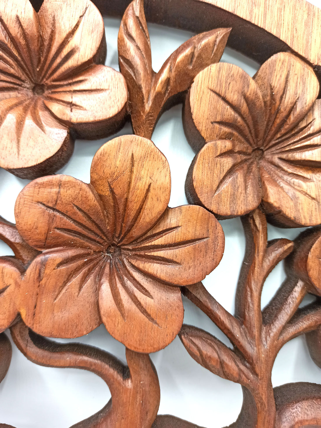Wooden floral carvings on a white background