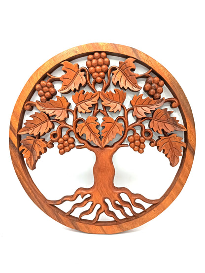 Wooden wall art depicting a tree with leaves and berries on a white background
