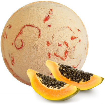 Bath bomb with papaya slices on a white background