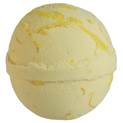 Yellow bath bomb with swirling pattern on a white background