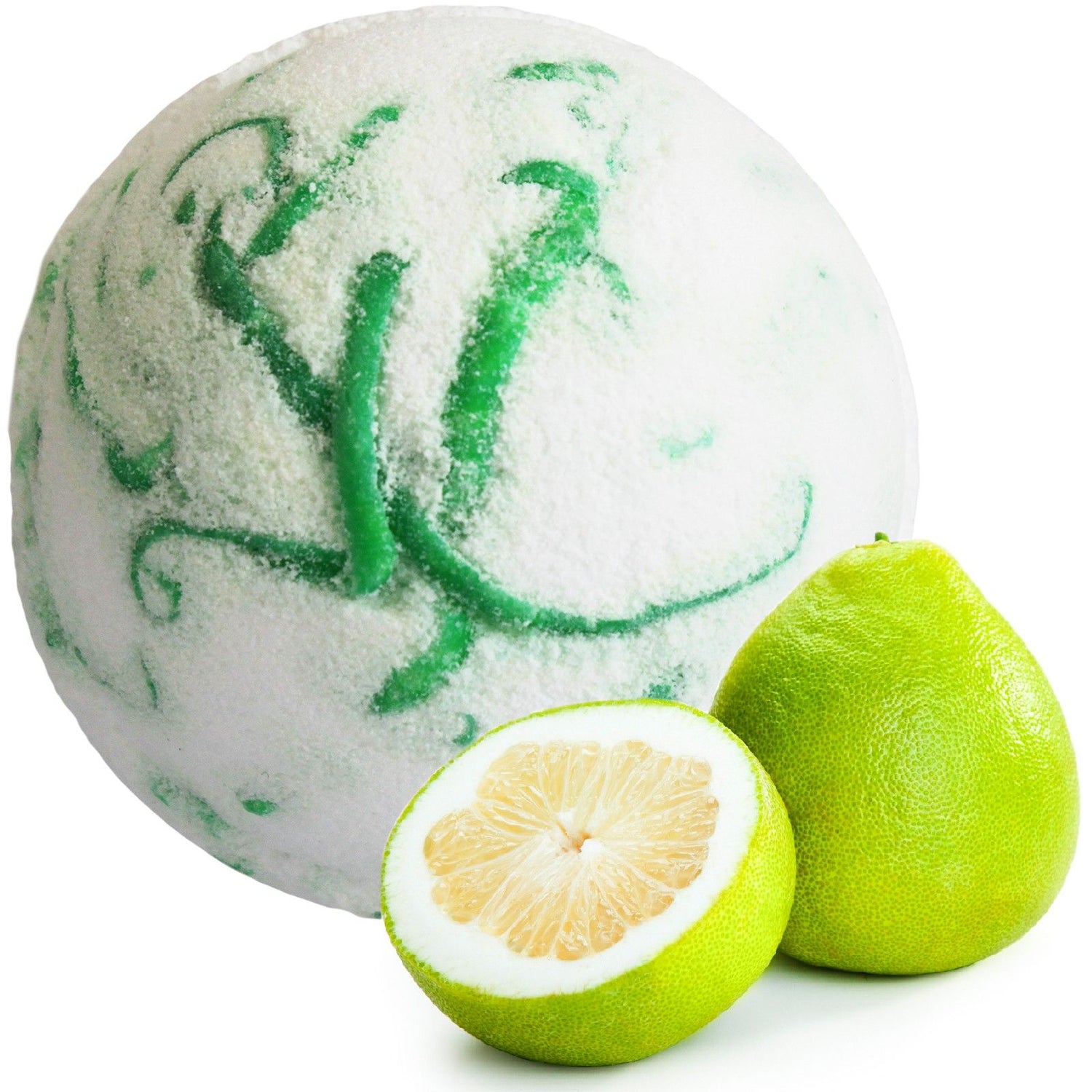 Bath bomb with green swirls next to a halved pomelo on a white background