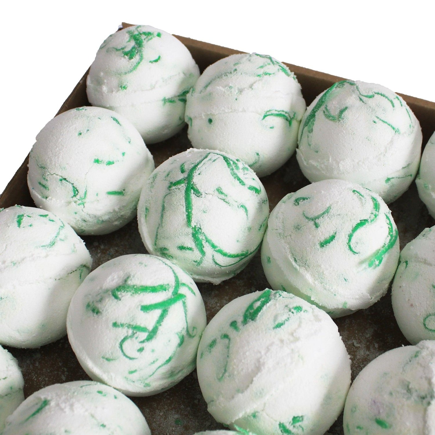 White bath bombs with green swirls in a cardboard box