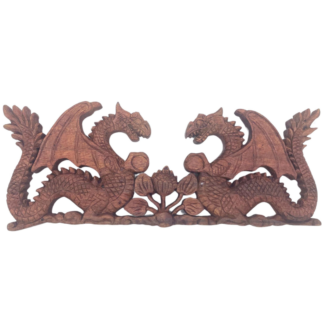 Wooden carvings of dragons on a white background